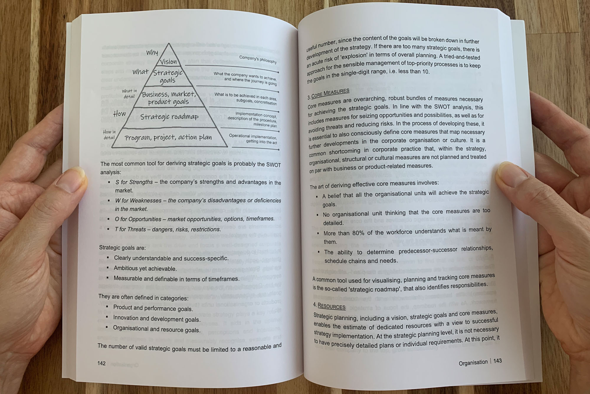 holding open book in hands